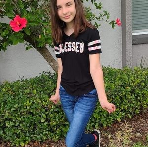 Black shirt with blessed lettering and stripes